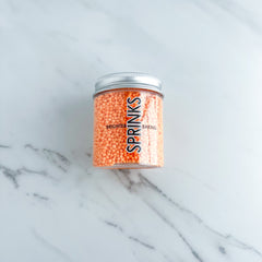 PASTEL PEACH NONPAREILS BY SPRINKS