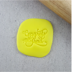 "CONGRATS GRAD" WITH GRAD CAP EMBOSSER